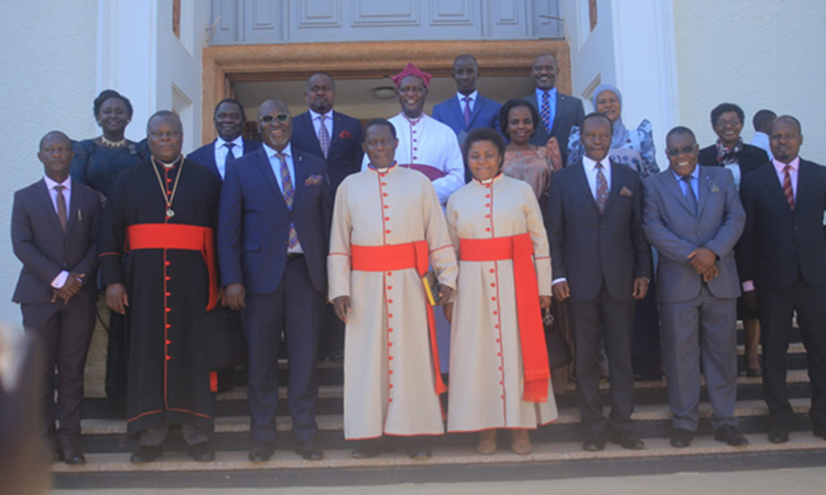 Rev can Bbanja and his wife between the ministers, Bishop Mutebi and others. Image