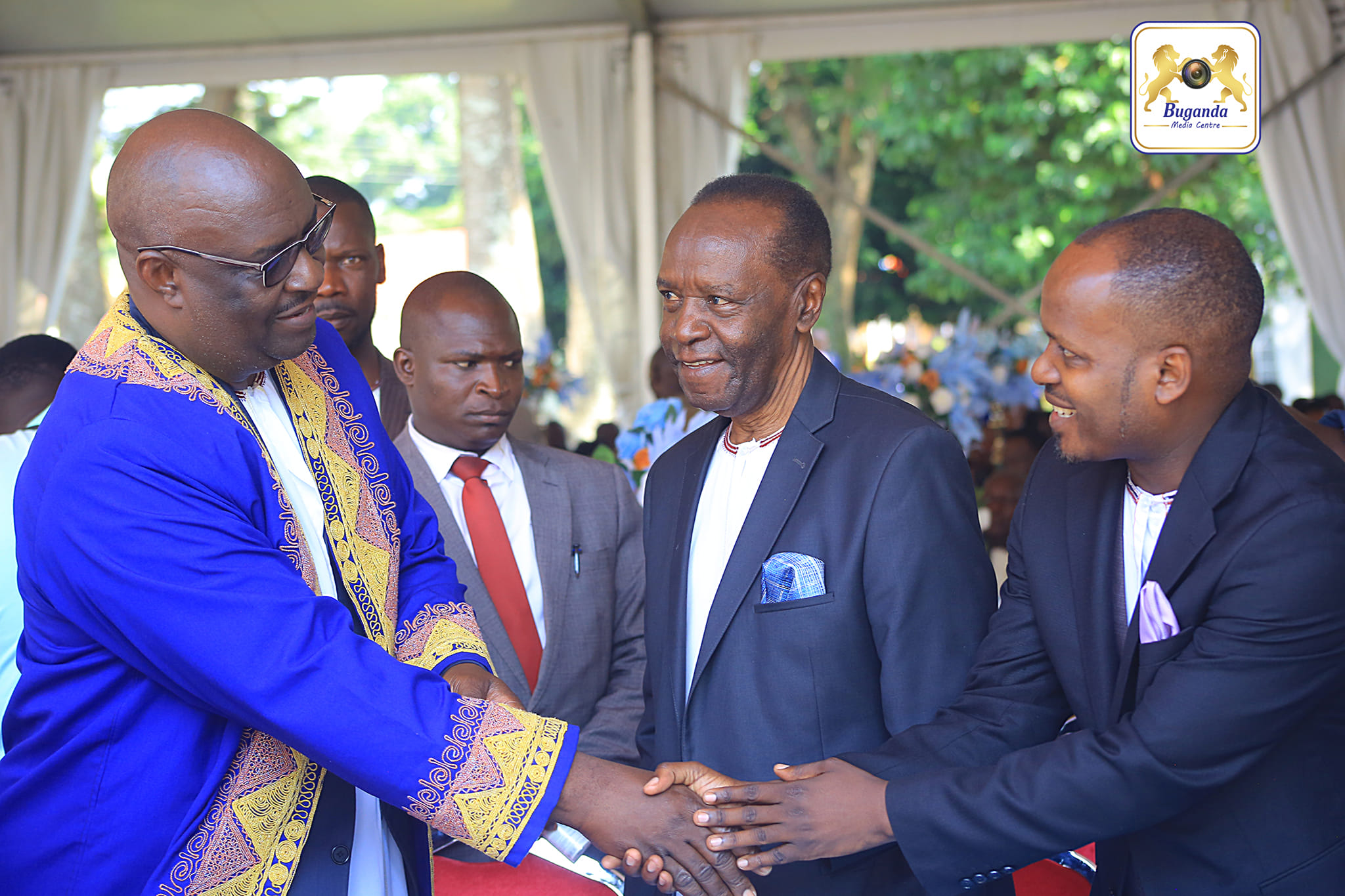 The prime minister of Bunyoro, Andrew Byakutaaga and Mr. Patrick Luwaga Mugumbule (centre) Image