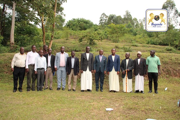 The chairman of clan heads Omutaka Namwama with the minister for culture at the Olugave Ancestral home Image