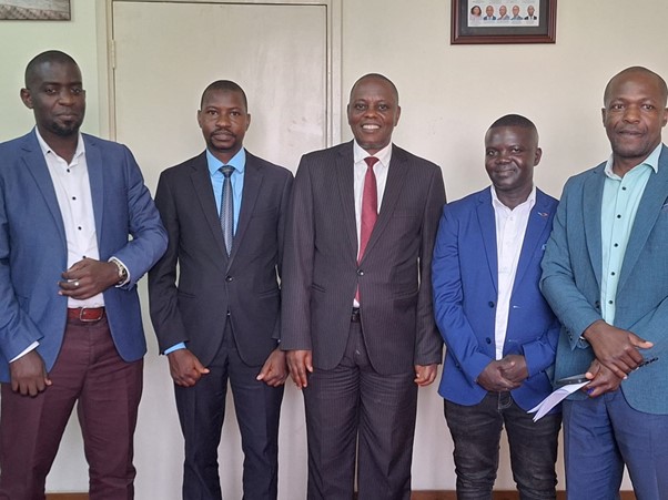 Hon. Anthony Wamala in the middle with ceremonial coordinators Image
