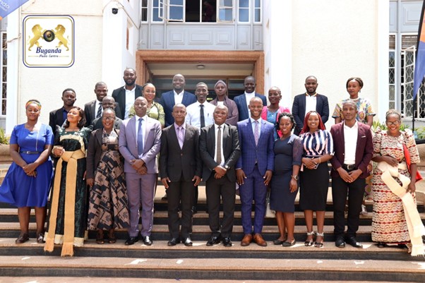 Hon.Robert Seranga with the youth in a group photo Image