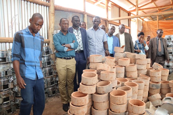 Here he visits the charcoal stove makers Image