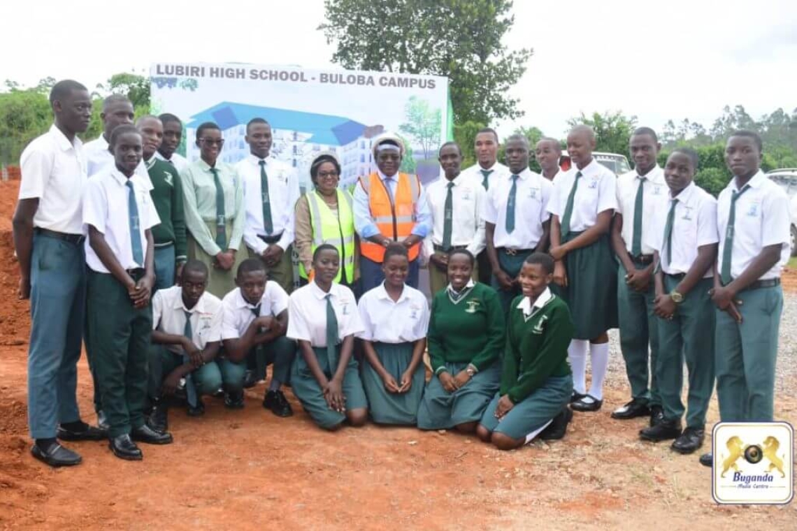 Some of the students pose with Hon. Dr Twaha Kaawaase Kigongo and Hon. Clotilda Nakate Kikomeko during the launch of the new dormitory plan Some of the students pose with Hon. Dr Twaha Kaawaase Kigongo and Hon. Clotilda Nakate Kikomeko during the launch of the new dormitory plan