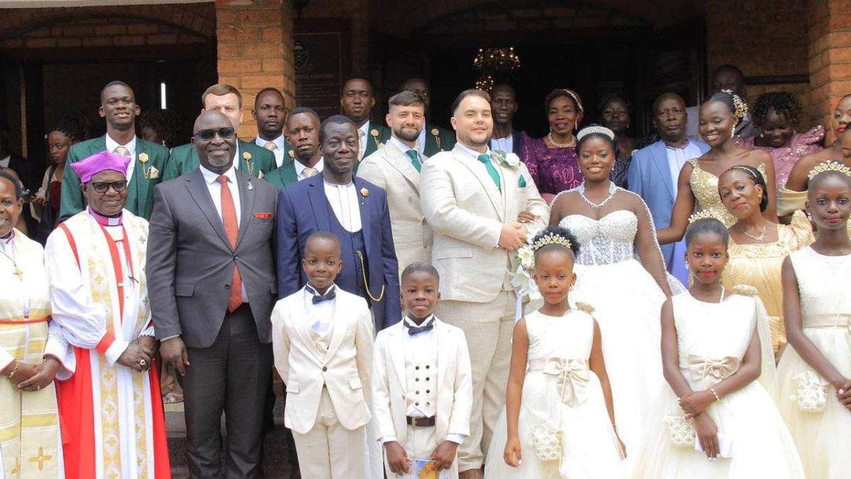 Owek. Robert Waggwa Nsibirwa with newlyweds Ben Foster and Leah Nandugga at Namirembe Cathedral. Owek. Robert Waggwa Nsibirwa with newlyweds Ben Foster and Leah Nandugga at Namirembe Cathedral.