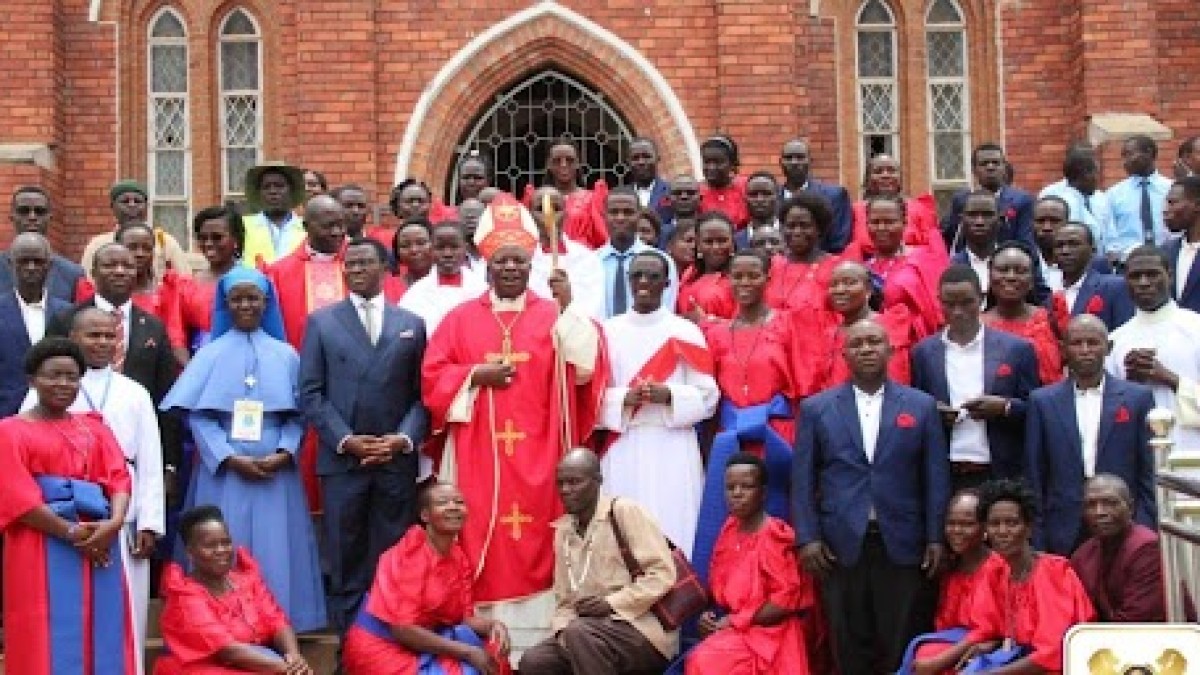 After the Mass, Katikkiro poses for a group photo with Bishop Jjumba After the Mass, Katikkiro poses for a group photo with Bishop Jjumba