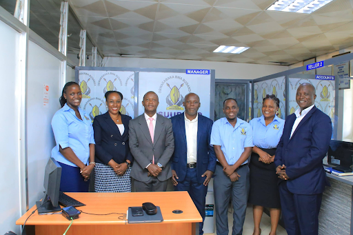 The Minister and SACCO leaders: Owek. Serwanga together with leaders of Essuubiryo Zambogo SACCO during the inspection visit held in Mengo.