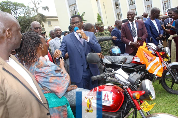 Katikkiro handing over the motorcycles to the sub-county chiefs Image