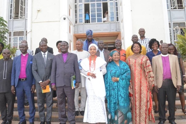 Queen Temitope in the middle putting on white with other delegates. Image