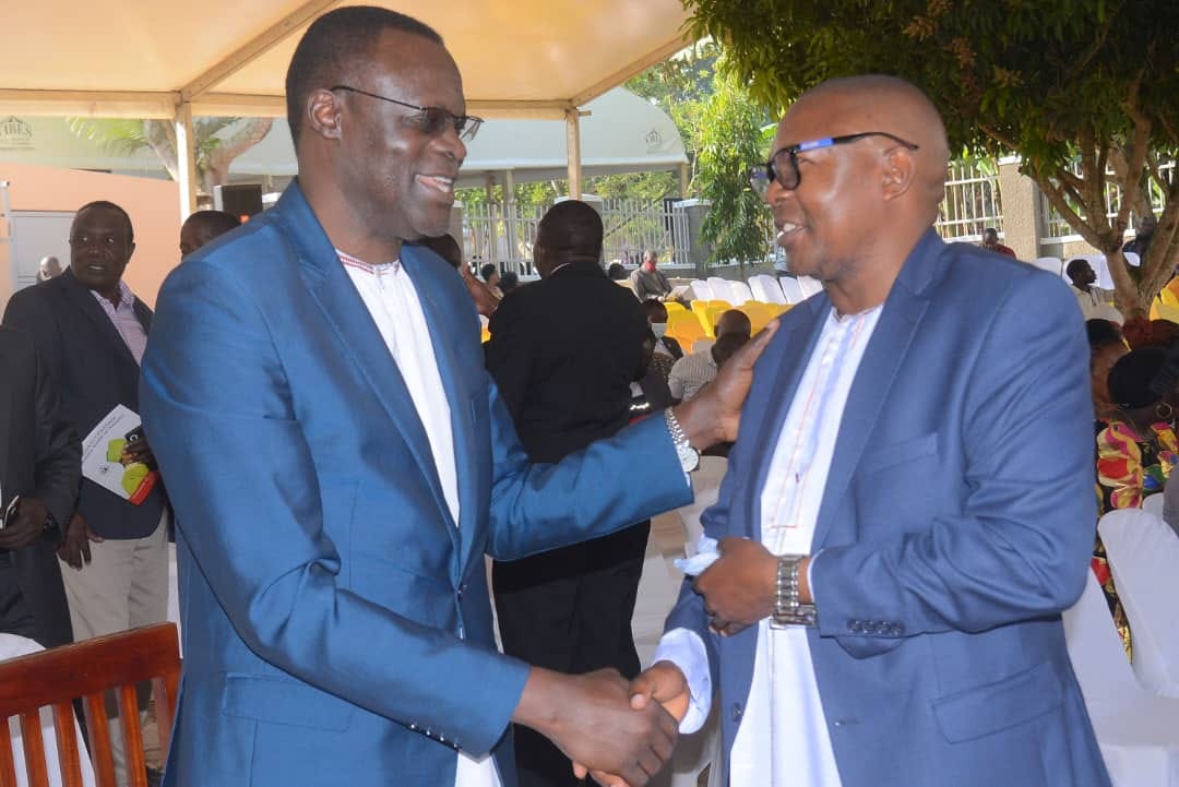 Omutaka Kizito on left being welcomed. Image