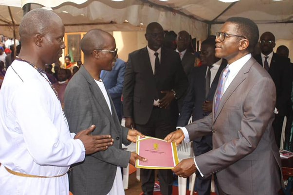 Min. Joseph Kawuki receiving the condolence massage delivered by the Katikkiro from Kabaka Image