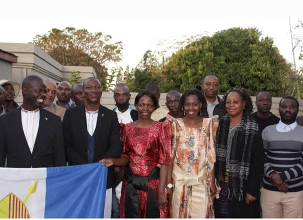 Oweek Ppookino Jude Muleke with the Kabaka's people in Botswana. Image