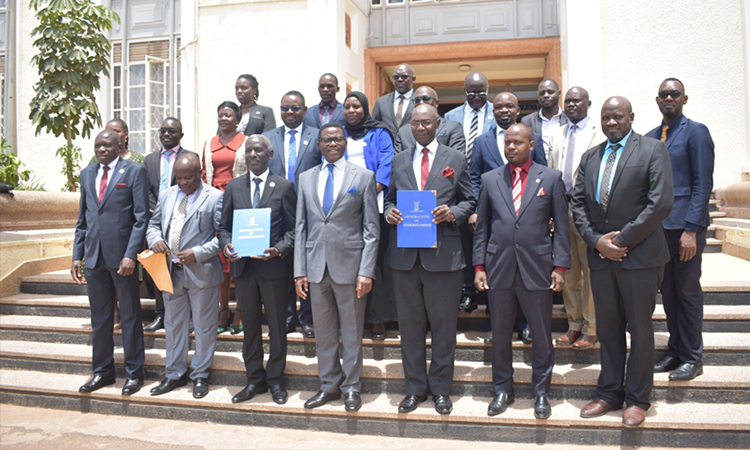 Katikkiro (Middle), Hon Amis Kakomo( 2nd on right) and other Officials Image