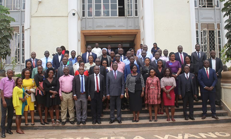 The Katikkiro with the kingdom staff members Image