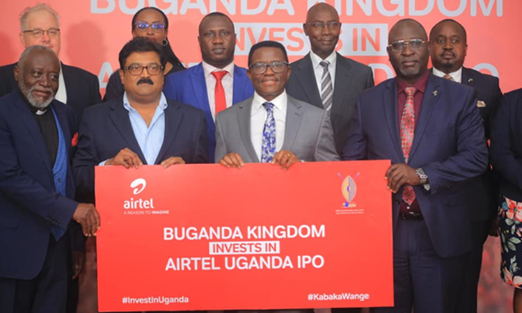 The Katikkiro officiating the shares with the Airtel group Director Manoj Murali Image