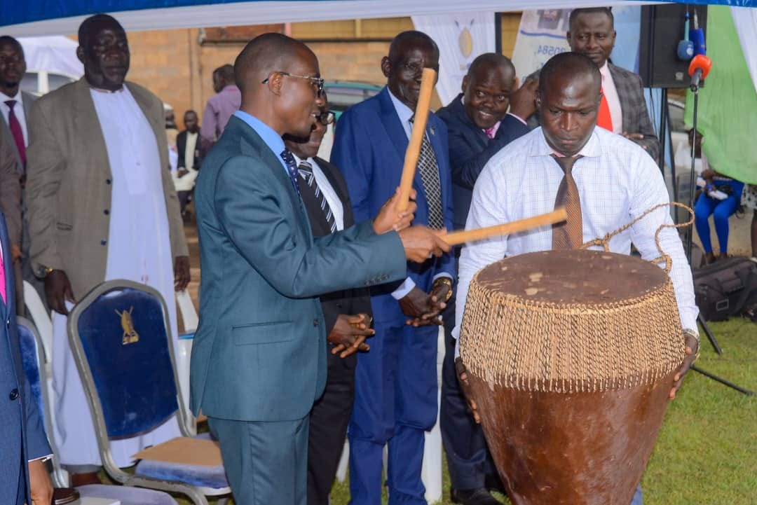 Minister. Joseph Kawuki in the middle plays the drums at the launch of this year’s Luwalo, at the Bulange. Image